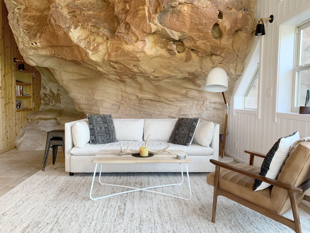 Take coffee table, leather lounge chair, and brand new, comfortable couch in the living room.