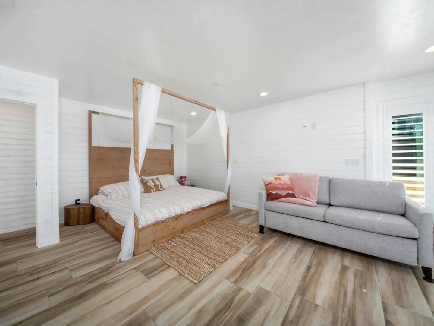 There is a king canopy bed, a sofa bed, and an ensuite bathroom.