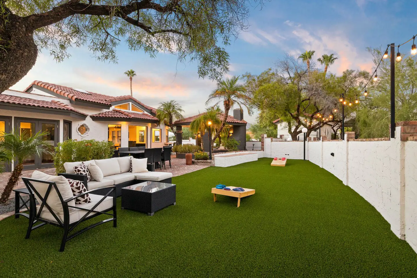 Relax and enjoy the outdoors in our greenspace area equipped with seating and a cornhole game.
