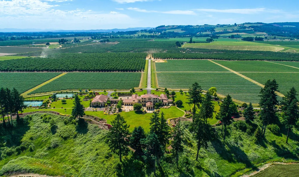 Surrounded by hazelnut and blueberry groves, Del Mar Villa features extensive grounds including well-kept lawns, patios, sports courts, walking paths, an arbor, and more.