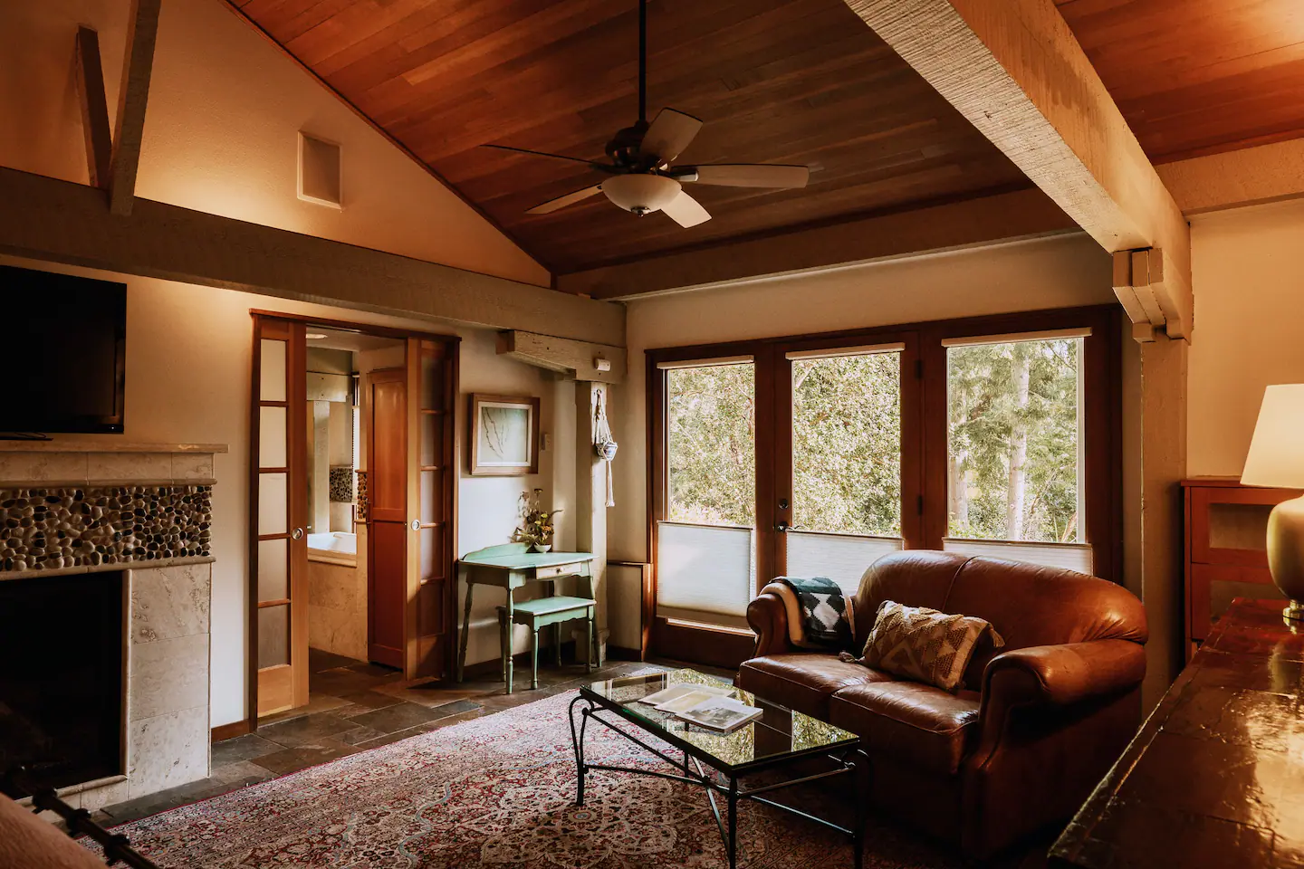The Primary Suite is located to the left and includes a King bed, with a private foyer situated behind it.