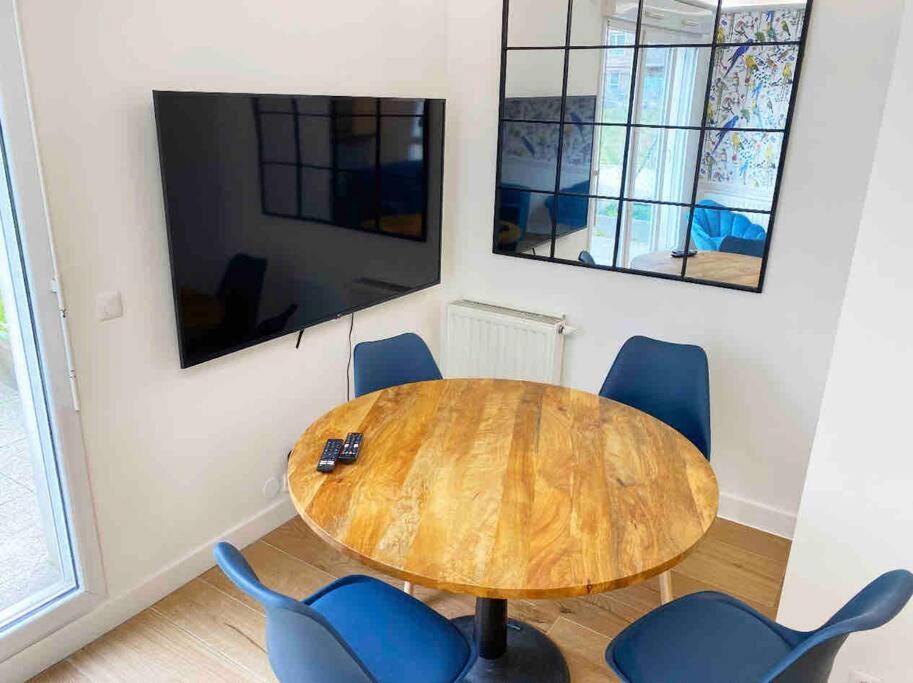 Office space with a flat tv screen.