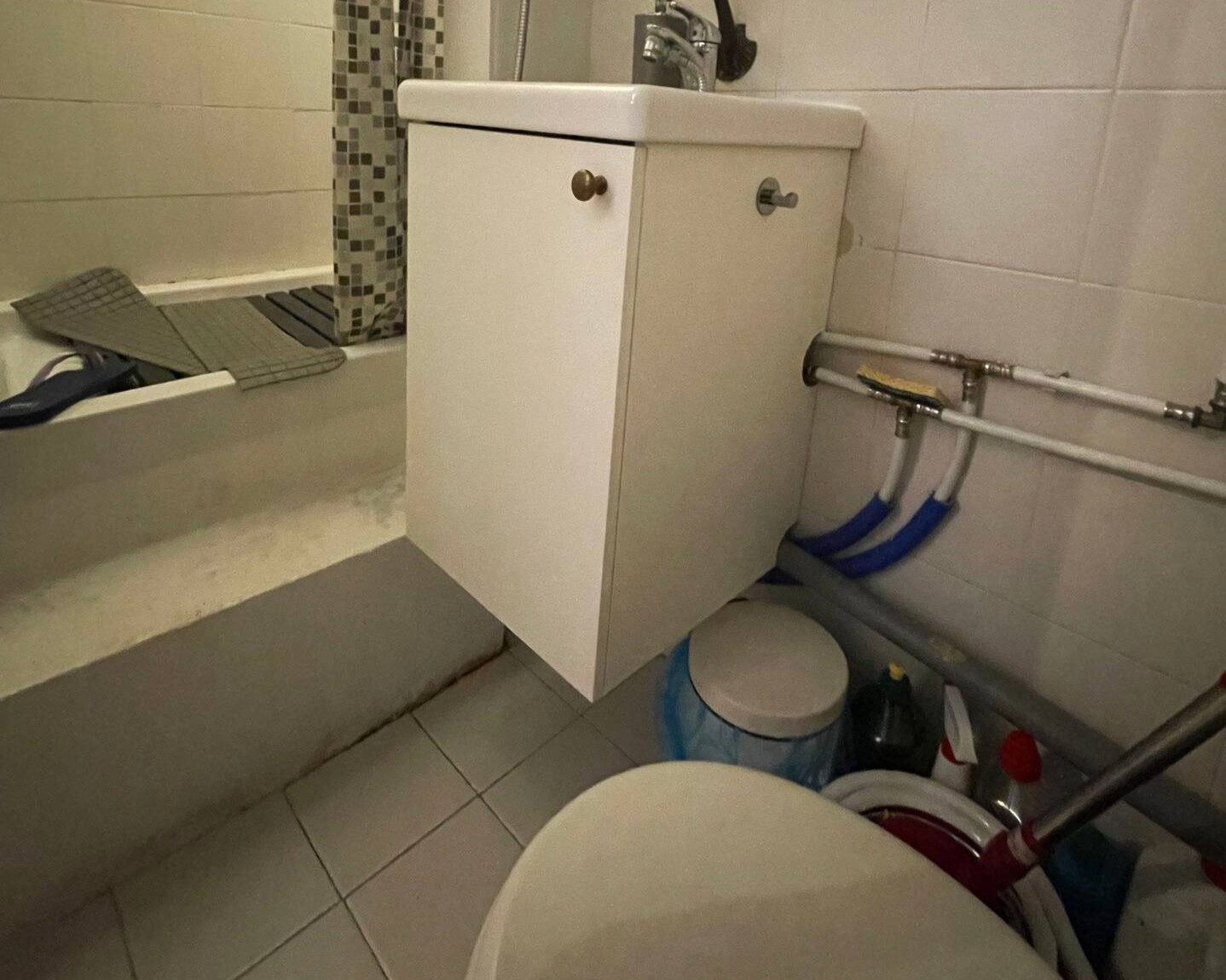 A small bathroom with shower.